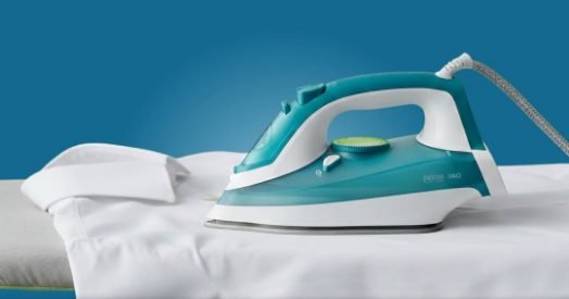 Iron pressing a white shirt